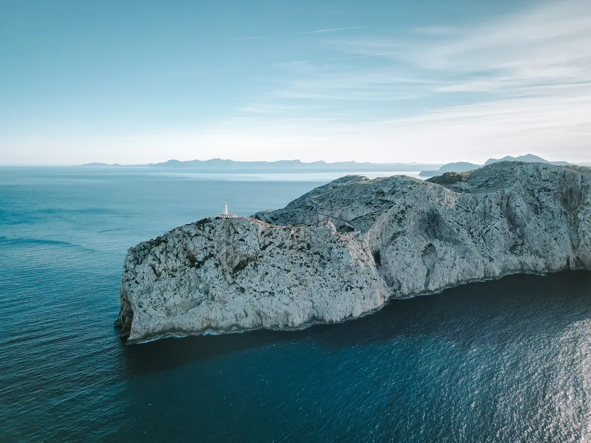 Aerial view of Cap de Formentor and its lighthouse above the sea