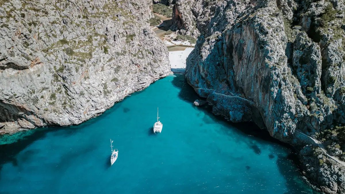 Sailing boats anchored at the mouth of the Torrent de Pareis, Sa Calobra